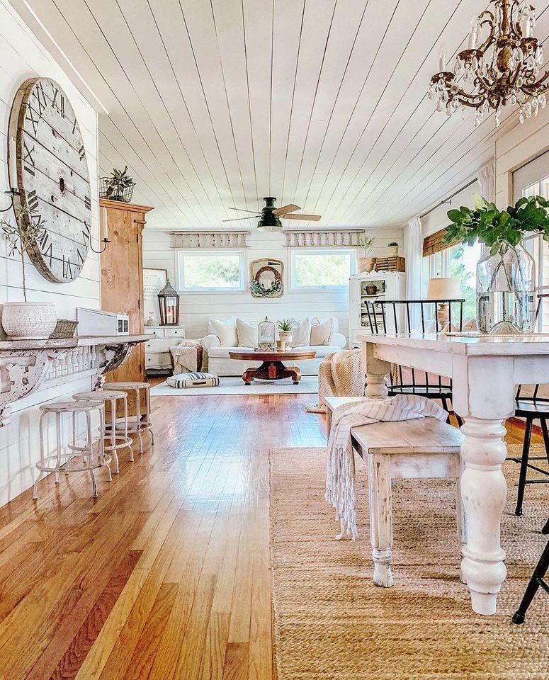 Floor to Ceiling Wall Paneling: 9 Rooms That Get It Right 8 White shiplap walls and planked ceiling in a bright, rustic living and dining room.