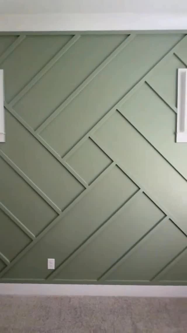 Geometric Accent Wall: 11 Ideas in Wood, Paint, and Light 2 Sage green geometric accent wall with raised wooden slats in a diagonal pattern.
