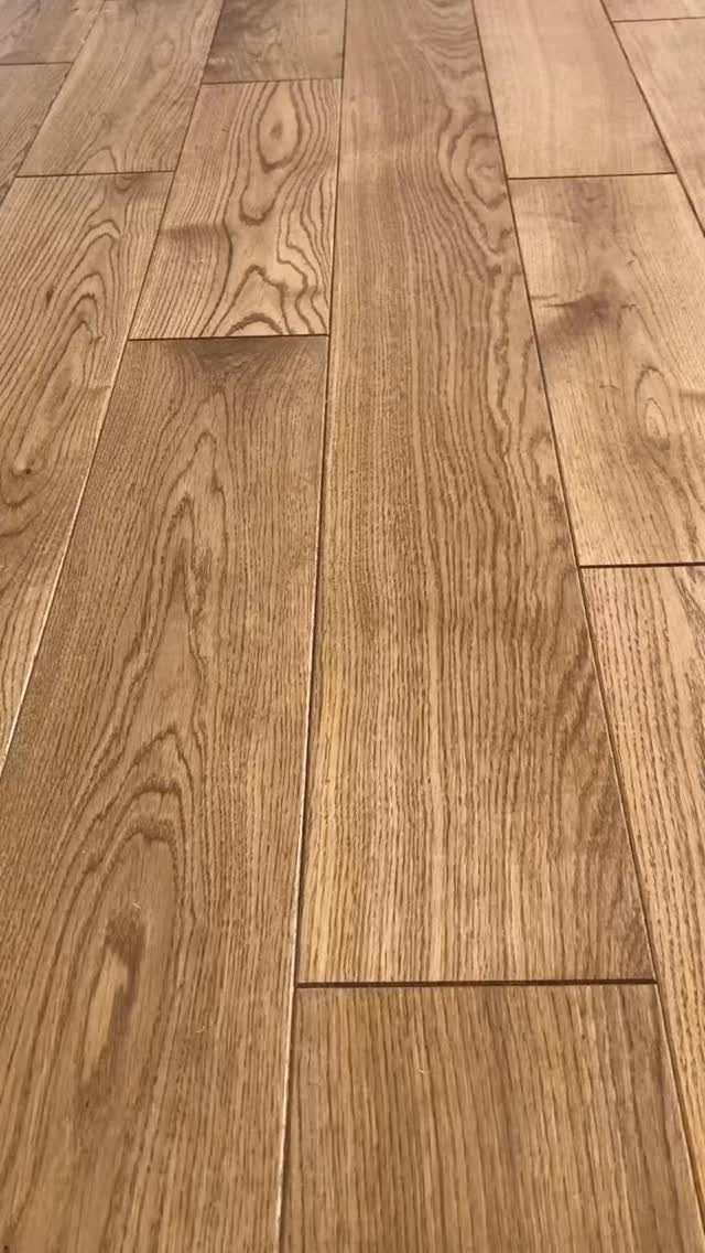 10 Hardwood Flooring Ideas for Every Room Style 4 Light-colored hardwood floor planks with prominent natural wood grain patterns.