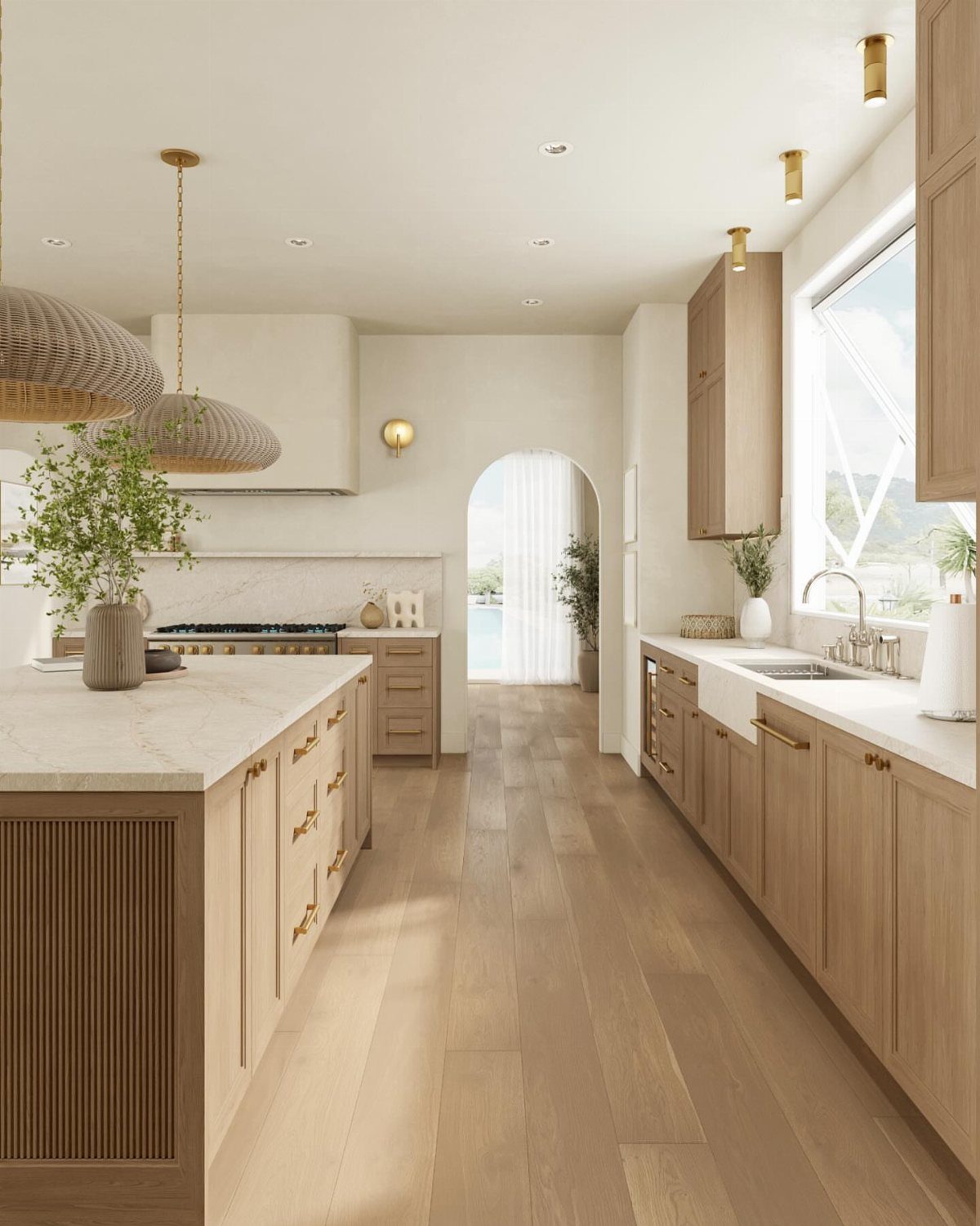 Light Wood Flooring: 10 Ideas That Actually Work 4 Light wood flooring runs through a bright, modern kitchen with wooden cabinets and marble countertops.