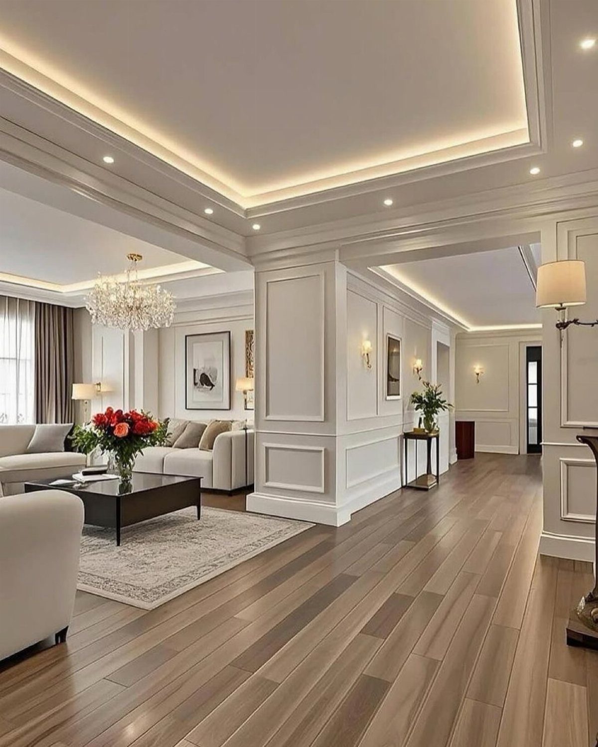 Light brown wooden plank flooring in a bright, modern living room with white furniture.