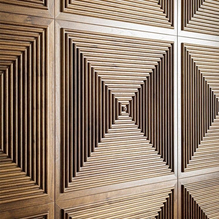Wooden wall panels featuring a geometric pattern of radiating slats forming starburst shapes.