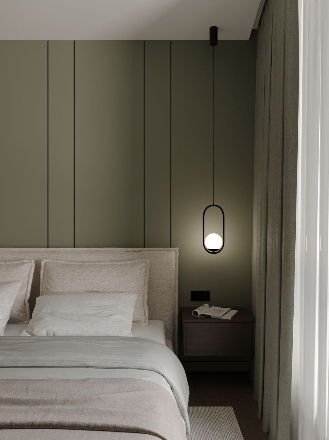 Vertical sage green wall paneling behind a bed with white linens and a pendant light.