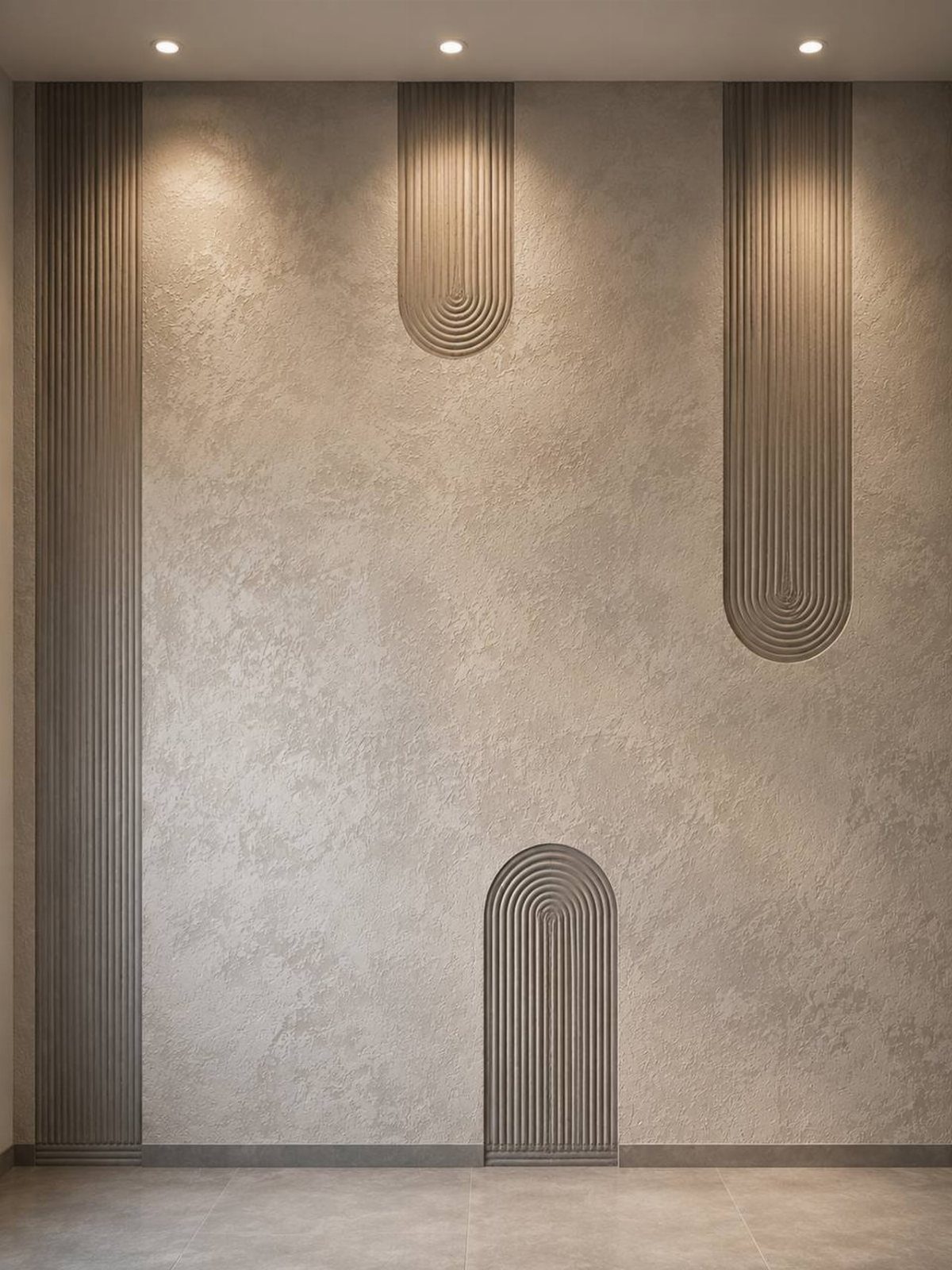 Textured beige wall featuring three vertical ribbed decorative panels under warm recessed ceiling lighting.
